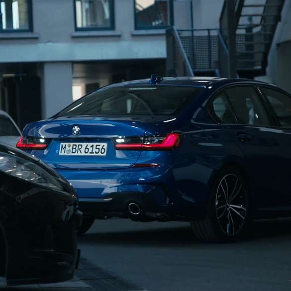 BMW 3 Series Sedan blue and black cars in traffic. BMW 3 Series Sedan blue and black cars in traffic.