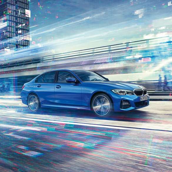 Driving shot of the BMW 3 Series Sedan 2018 from the side view in the daylight. Driving shot of the BMW 3 Series Sedan 2018 from the side view in the daylight.