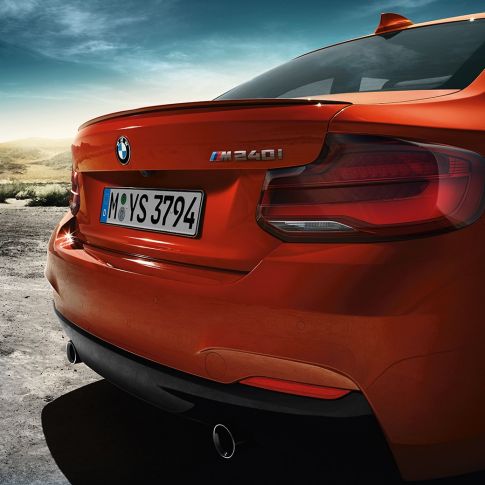 Rear design BMW M240i Coupé Rear design BMW M240i Coupé F22 2017 Sunset Orange metallic three-quarter rear view