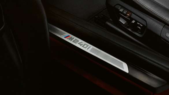 Door sill finishers with M240i designation BMW M240i Coupé Door sill finishers with M240i designation BMW M240i Coupé F22 2017 Sunset Orange metallic detail view