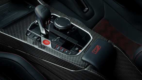 Carbon centre console with red CS badge BMW M3 CS G80 BMW M3 CS G80 Carbon centre console with red CS badge close-up cockpit