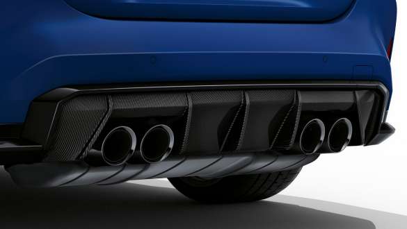 M Sport exhaust system BMW M4 Competition Cabriolet with M xDrive G83 2021 BMW M4 Competition Cabriolet with M xDrive G83 2021 Frozen Portimao Blue metallic M Sport exhaust system close-up rear diffusor
