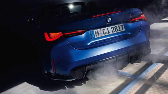 BMW M4 Competition Cabriolet with M xDrive G83 2021 close-up rear BMW M4 Competition Cabriolet with M xDrive G83 2021 BMW Individual Frozen Portimao Blue close-up rear