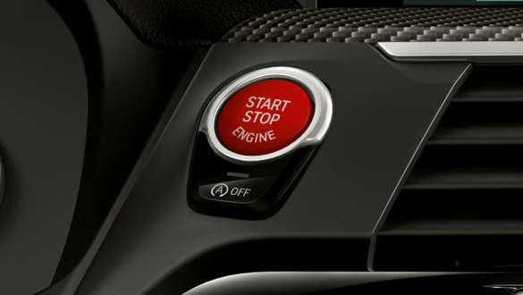 BMW X3 M Competition, red Start/Stop button. BMW X3 M Competition, interior, cockpit, red Start/Stop button.