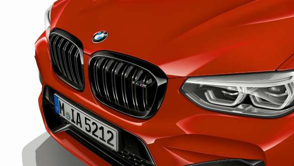 BMW X4 M Competition, front with M kidney grille. BMW X4 M Competition in Toronto Red metallic, exterior, front with M kidney grille in Black high-gloss.