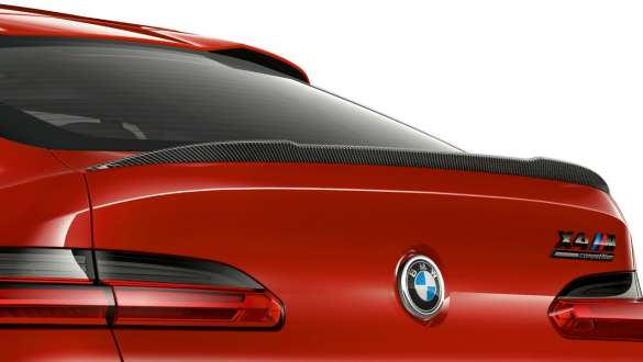 BMW X4 M Competition, M rear spoiler in carbon. BMW X4 M Competition in Toronto Red metallic, exterior, M Carbon exterior package, M rear spoiler in carbon.