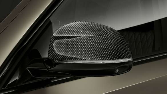 BMW X6 M50i M SUV Carbon mirror caps. BMW X6 M50i G06 SUV with close-up on M Carbon mirror caps.