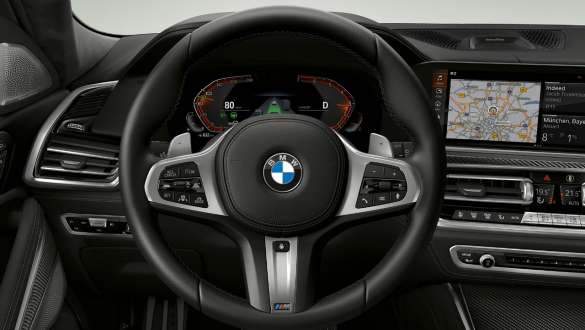 BMW X6 M50i SUV Interior M leather steering wheel Close-up BMW X6 M50i G06 SUV interior M leather steering wheel
