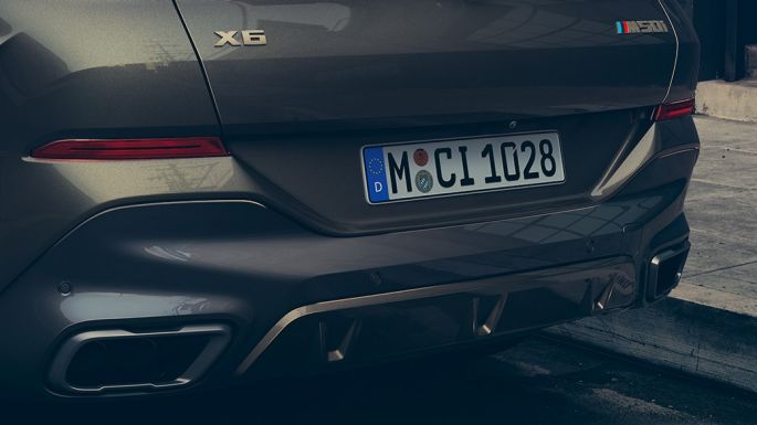 BMW X6 M50i SUV rear view Close-up of the BMW X6 M50i SUV rear
