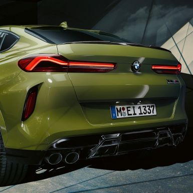 BMW X6 M Competition SUV three-quarter rear view BMW X6 M Competition with M Sport exhaust system F96 SUV BMW Individual Special Paint Urban Green three-quarter rear view