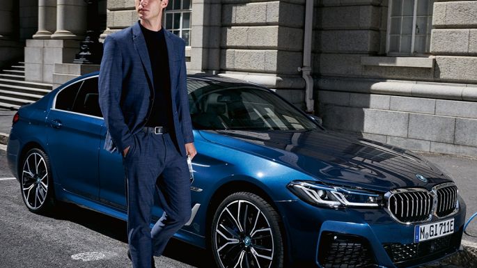 man walking beside car man walking beside car