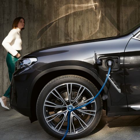 woman with car charging woman with car charging