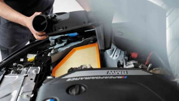 BMW sales associate helping a customer BMW sales associate helping a customer