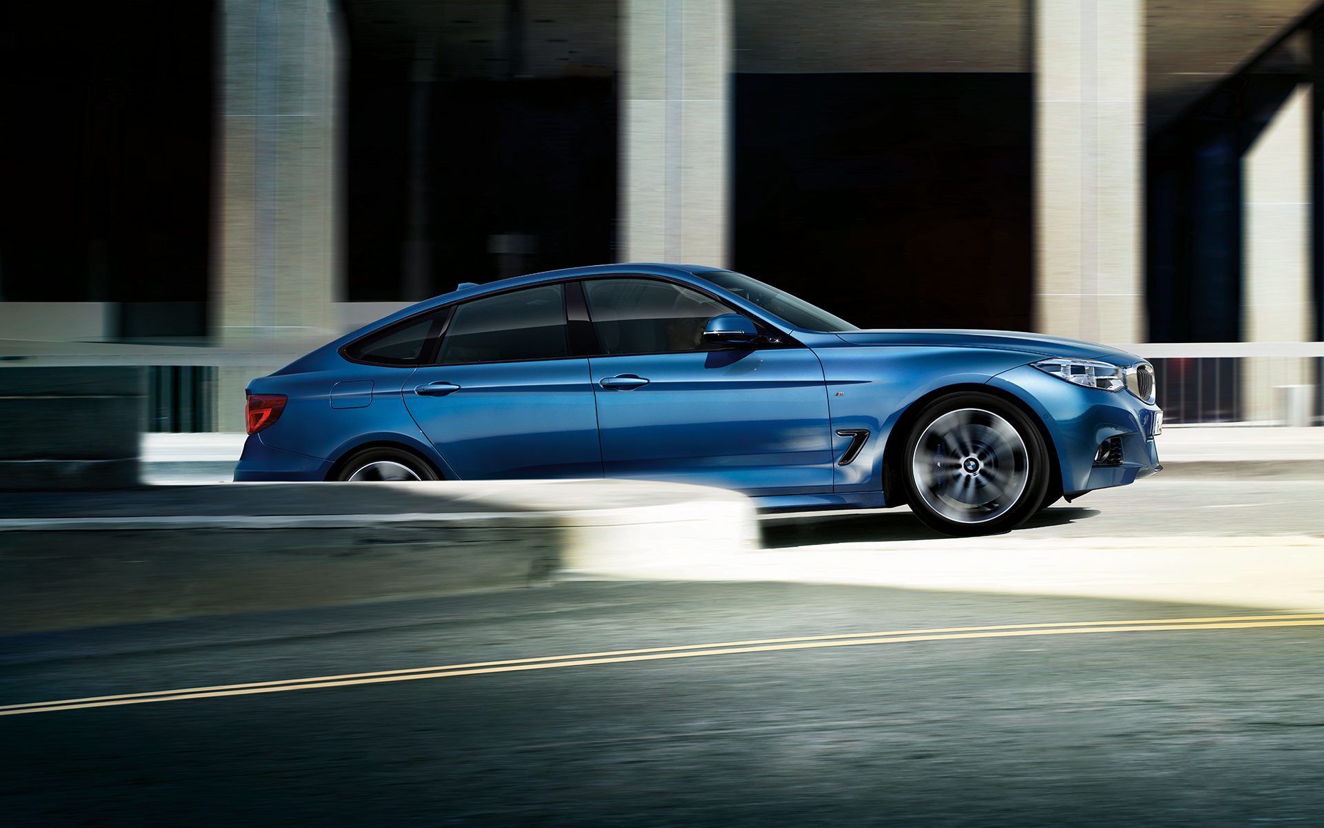 BMW 3 Series Gran Turismo in blue color side View, test drive. BMW 3 Series Gran Turismo in blue color side View, test drive.