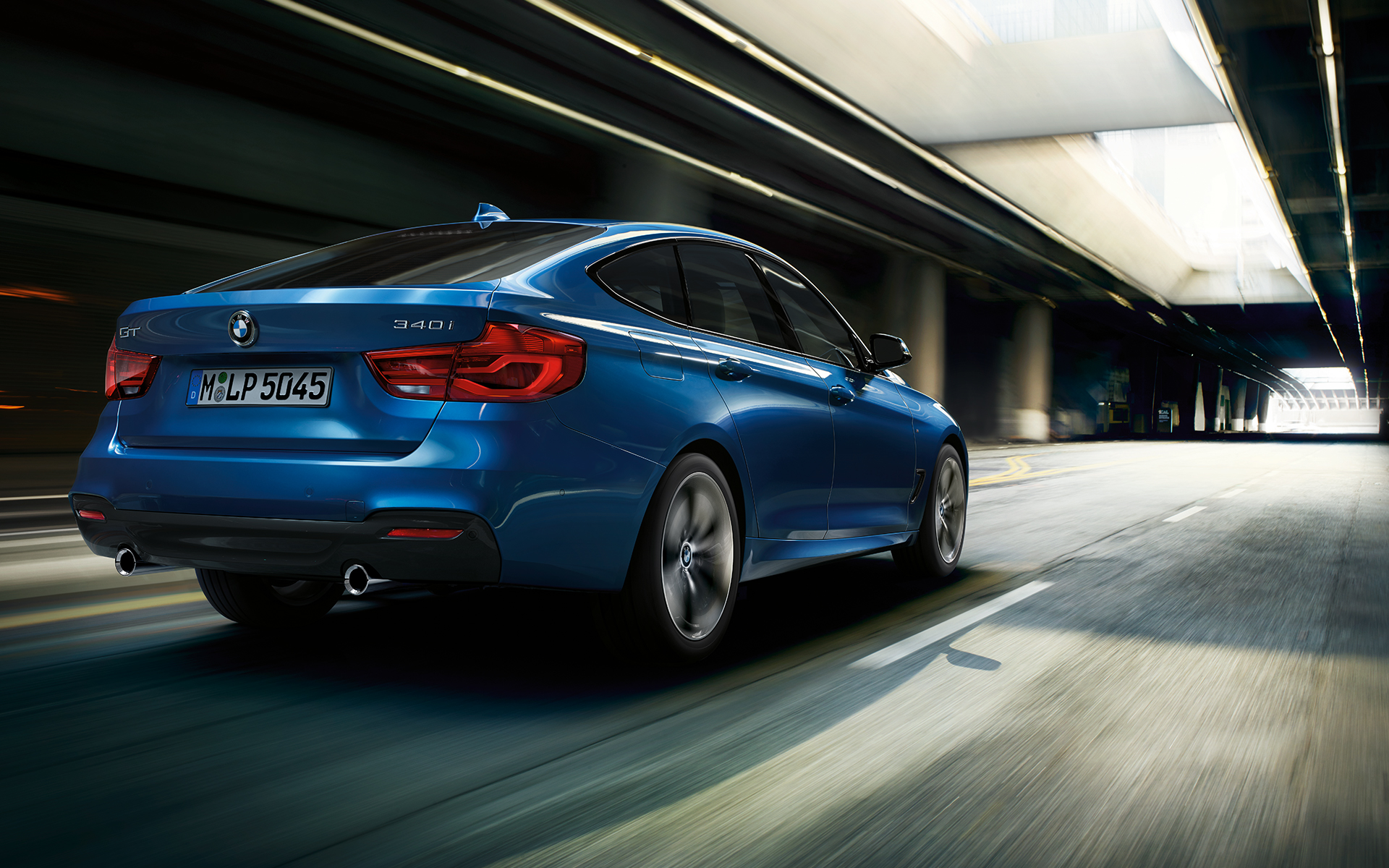 BMW 3 Series Gran Turismo in metallic blue: rear side view. BMW 3 Series Gran Turismo in metallic blue: rear side view.