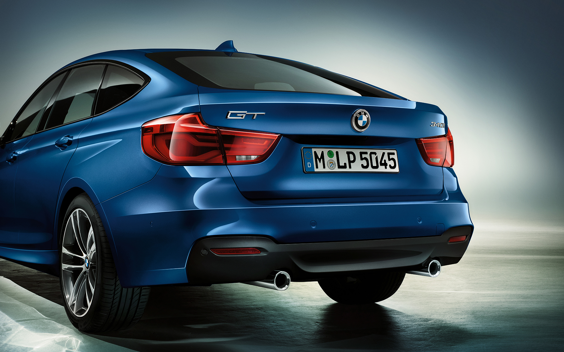 BMW 3 Series Gran Turismo in bright blue with backlights and license plate. BMW 3 Series Gran Turismo in bright blue with backlights and license plate.