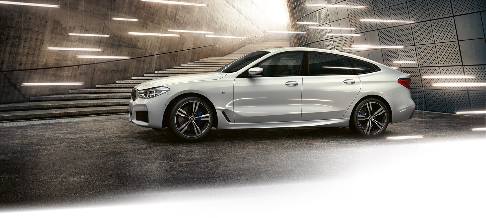 BMW 6 Series Gran Turismo: metallic car in front of steps. BMW 6 Series Gran Turismo: metallic car in front of steps.