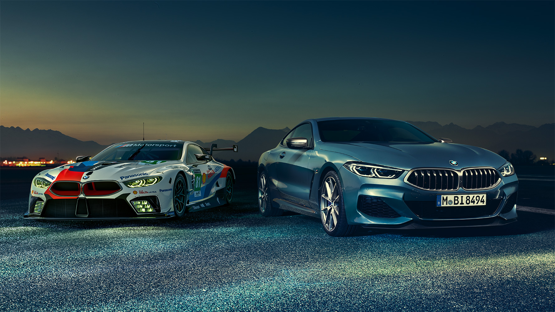 Still shot of the BMW 8 Series Coupé and M8 GTE in an urban area at night.