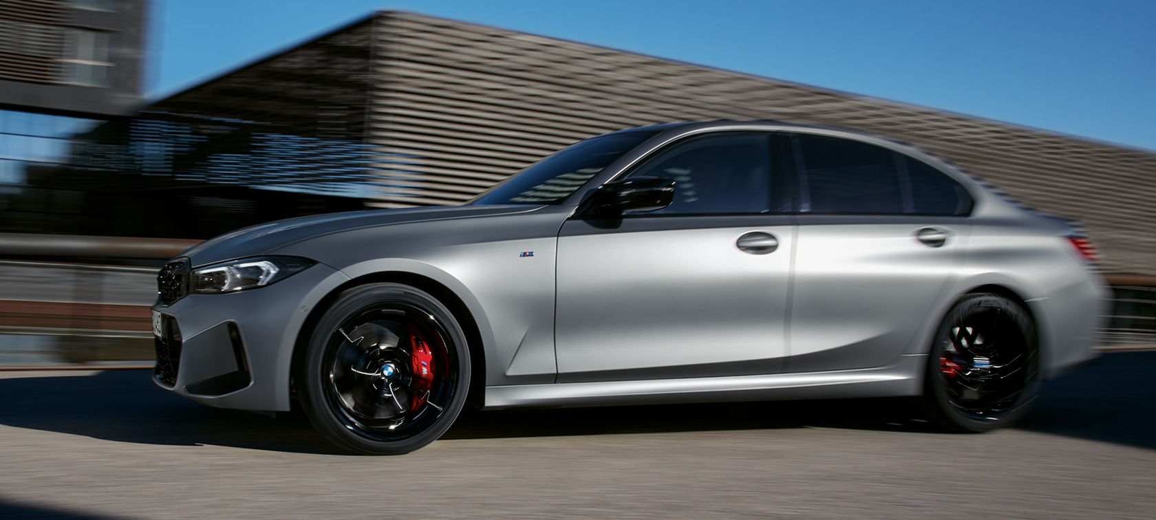 BMW M340i xDrive Sedan G20 BMW Individual Frozen Pure Grey side view driving on the street