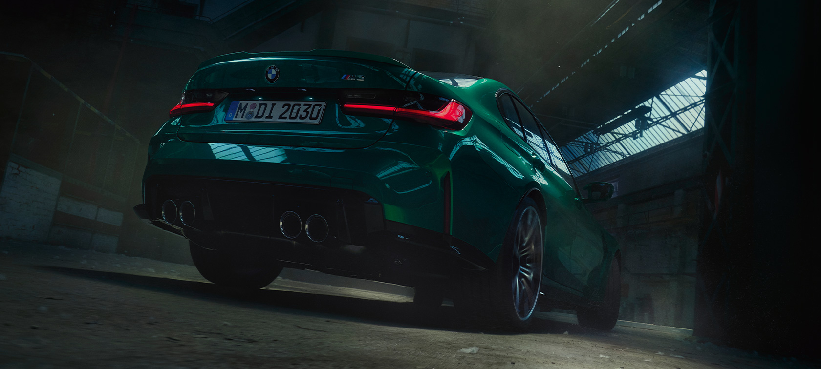 BMW M3 Sedan G80 2020 Isle of Man Green metallic three-quarter rear view worm's-eye view