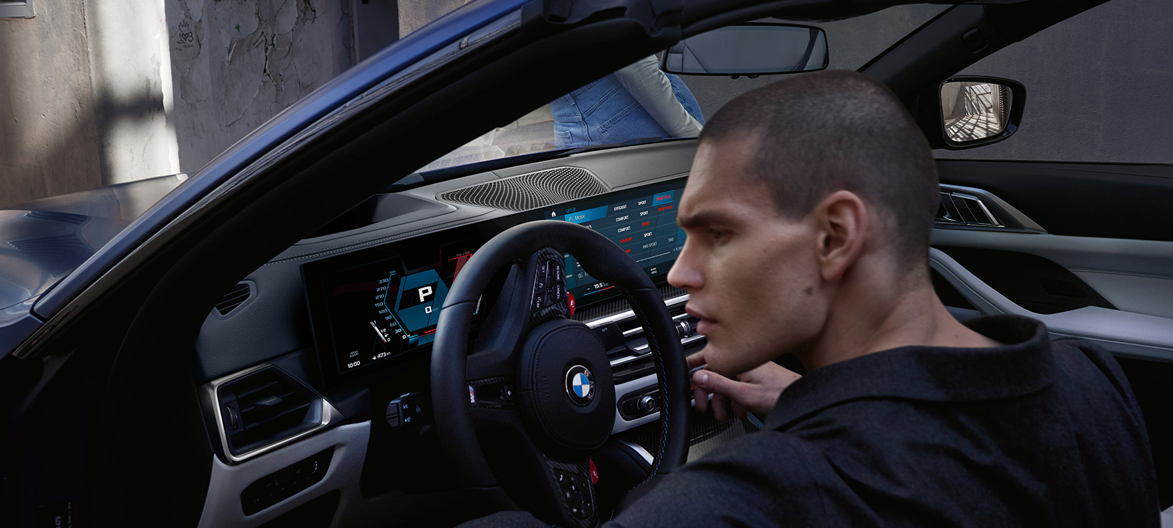 BMW M4 Competition Cabriolet with M xDrive G83 2021 cockpit BMW M4 Competition Cabriolet with M xDrive G83 2021 BMW Individual Frozen Portimao Blue metallic cockpit with open door and male model