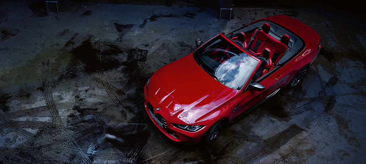 BMW Individual Imola Red metallic BMW M4 Competition Cabriolet with M xDrive G83 2021 BMW M4 Competition Cabriolet with M xDrive G83 2021 BMW Individual Imola Red metallic three-quarter front view bird’s eye view with open softtop