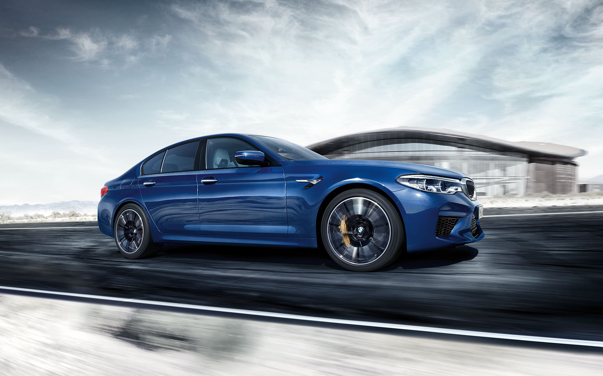 BMW M Series M5 Sedan: bright blue side view, fast car. BMW M Series M5 Sedan: bright blue side view, fast car.