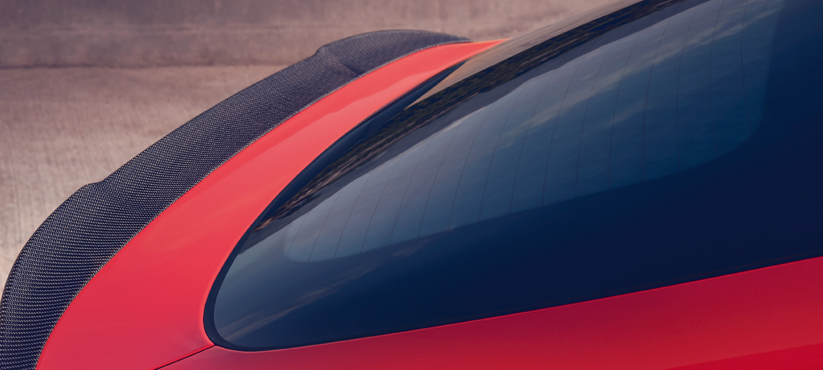 BMW X4 M Competition, M rear spoiler in carbon. BMW X4 M Competition in Toronto Red metallic, exterior, M Carbon exterior package, M rear spoiler in carbon.