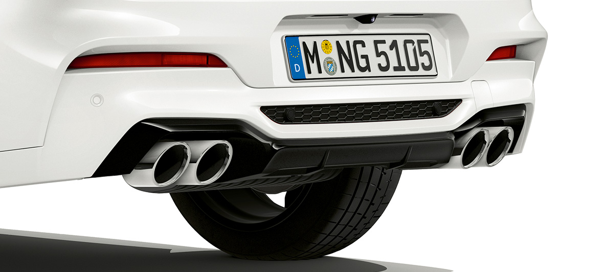 BMW X4 M, exhaust pipes in chrome. BMW X4 M in Alpine White, exterior, rear with exhaust pipes in chrome.