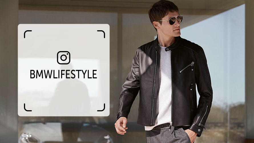 Discover BMW Lifestyle on Instagram. A young man is wearing pieces from the BMW Lifestyle Collection.