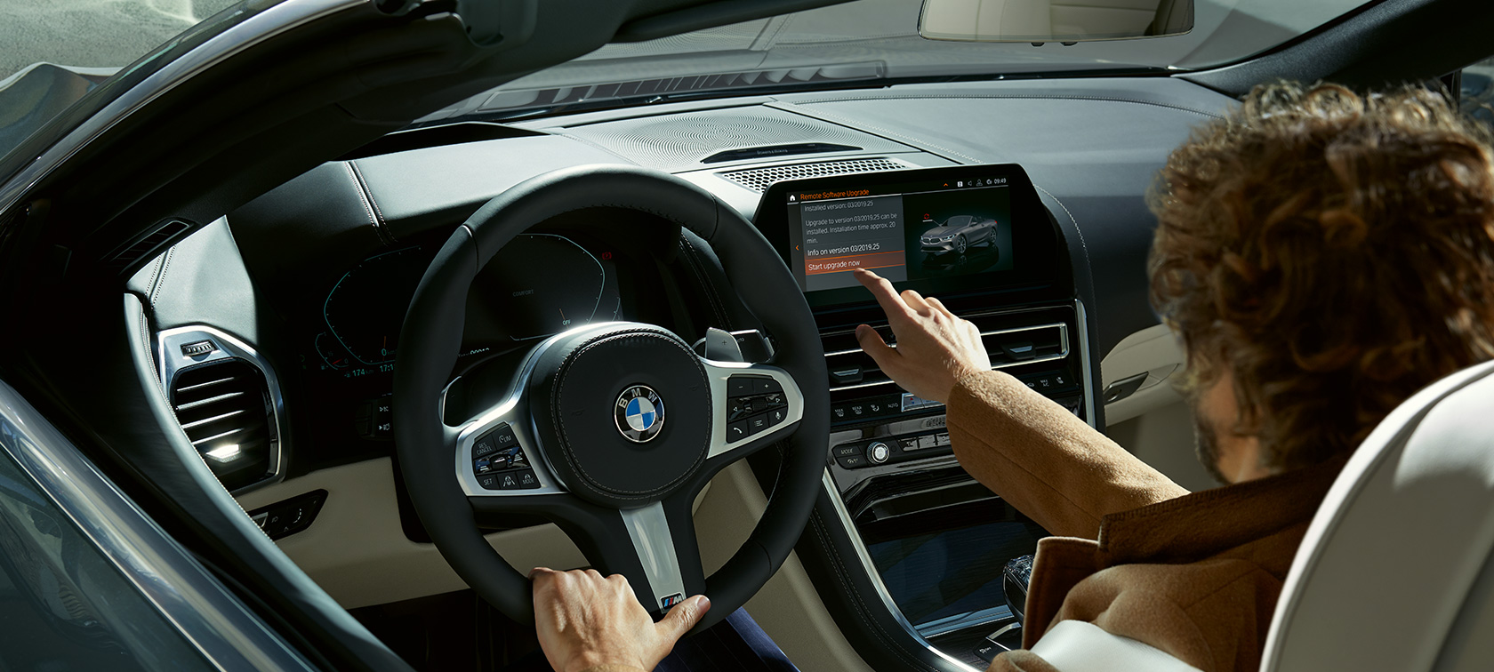BMW Remote Software Upgrade Man sitting in BMW starting the BMW Remote Software Upgrade