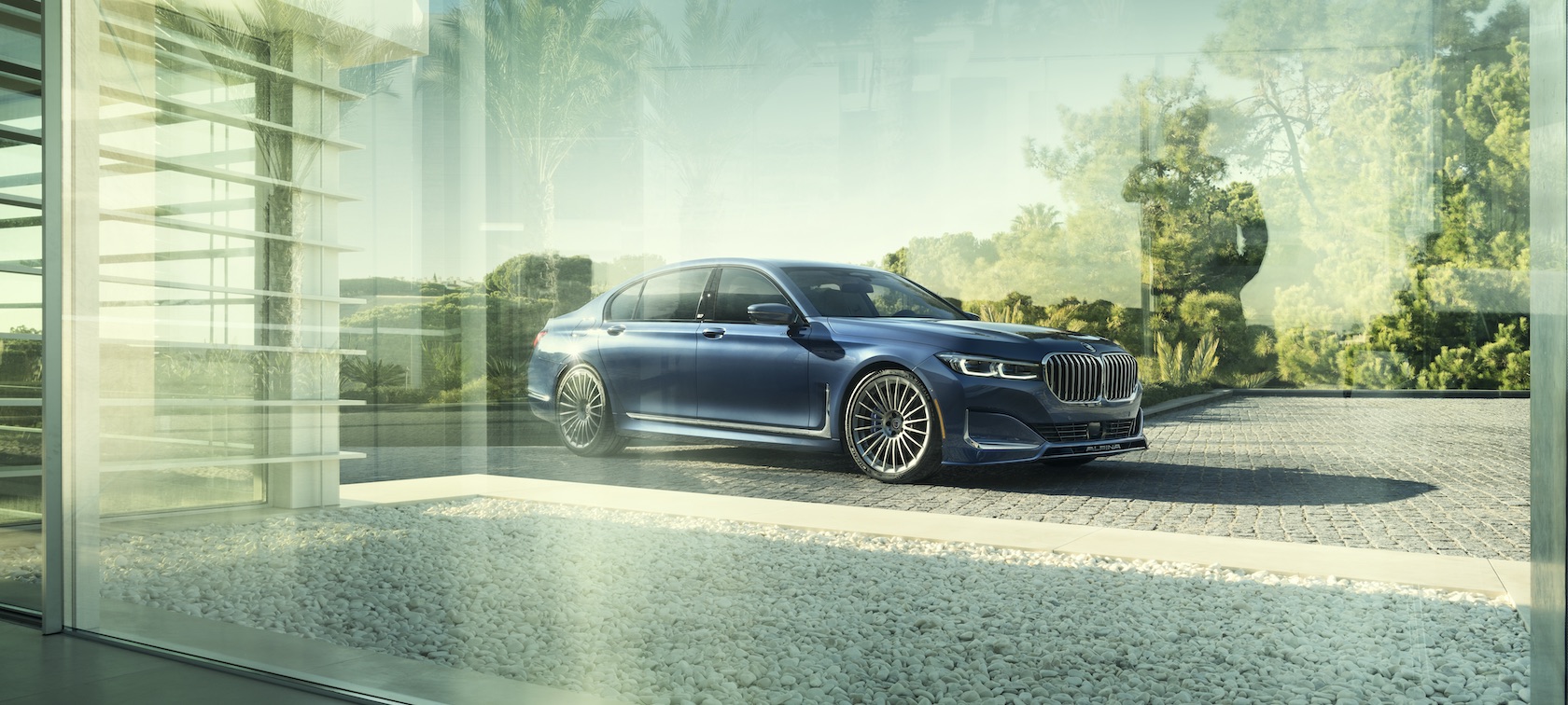 alpina-b7_desktop2 Parked Alpina B7 seen through a window with sun rays in the background