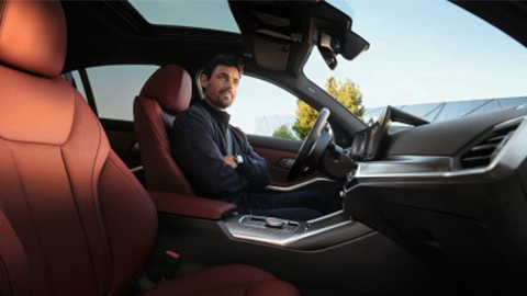 BMW Financial Services man insde of a BMW