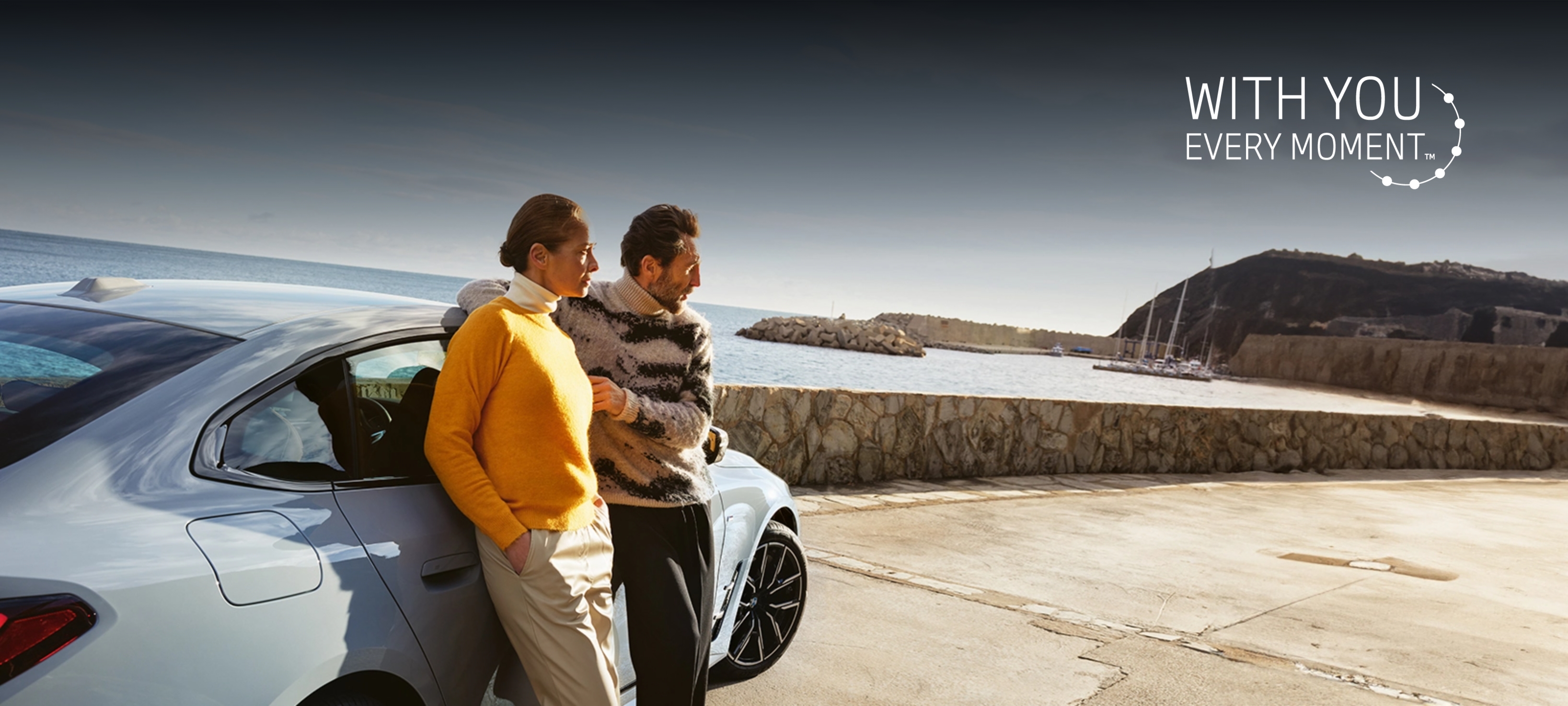 Resource Hub Header man and woman leaning on BMW