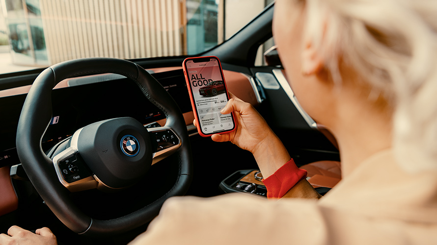 Woman looking at My  BMW app