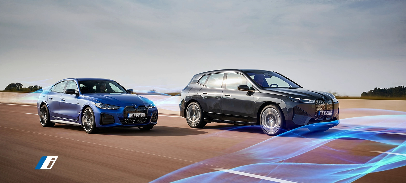 BMW i4 and BMW iX driving. BMW i4 and BMW iX driving.