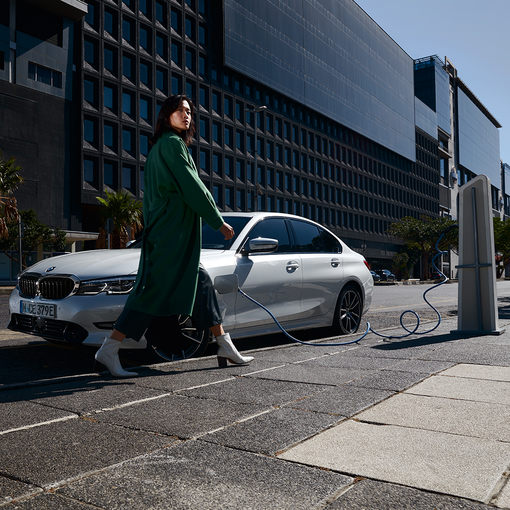 woman with car charging woman with car charging