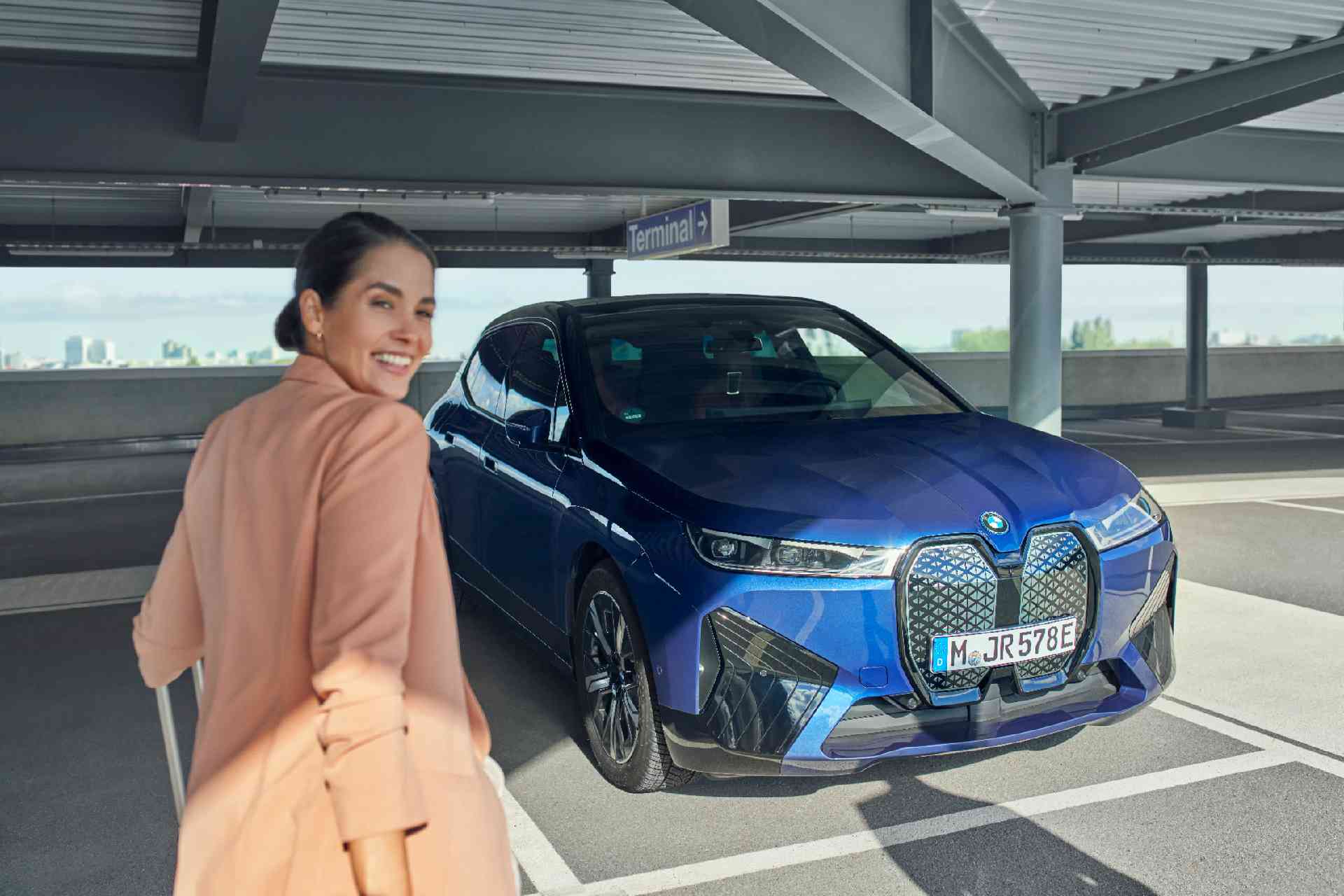 Woman puts her feet on the door of a BMW BMW Financial Services BMW Leasing woman puts her feet on the door of a BMW