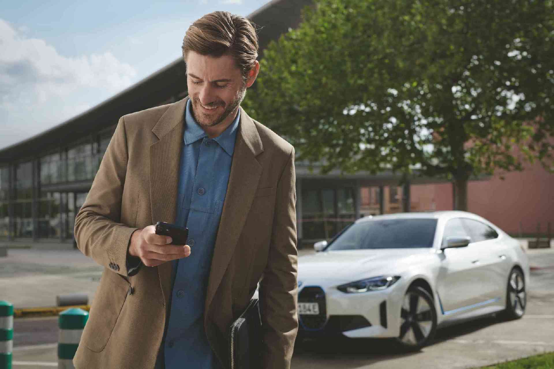  BMW Financial Services man with BMW i3 on charging station