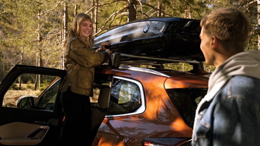 BMW Financial Services Woman in front of BMW iX3 