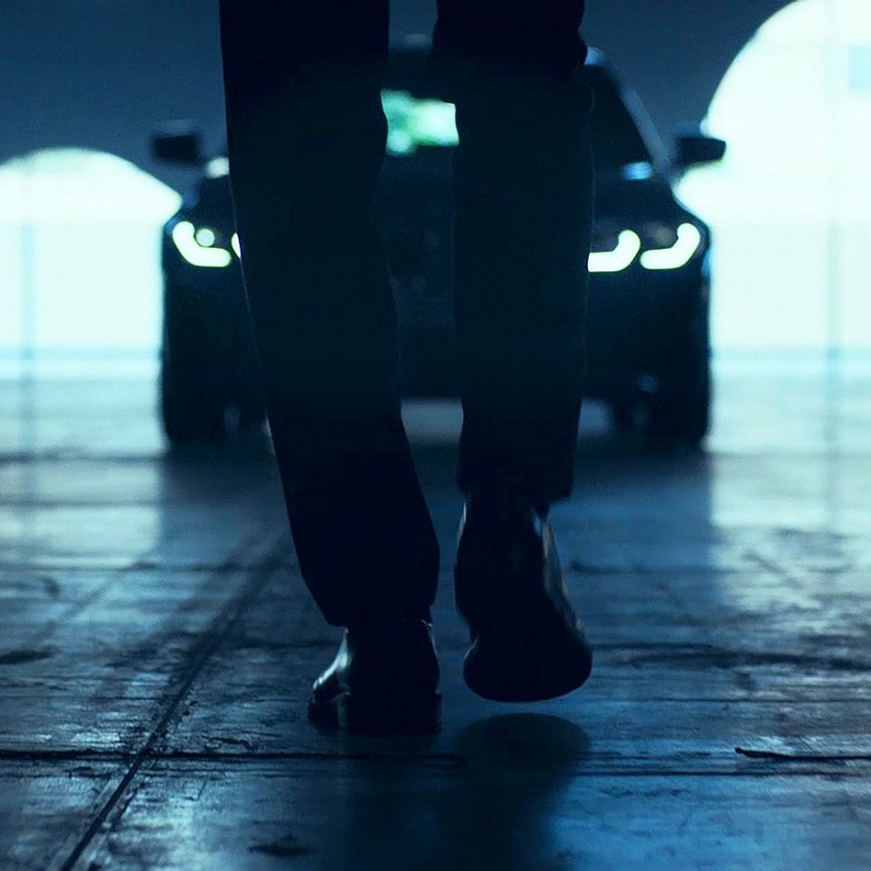 Man in front of the BMW 3 Series Sedan. Man in front of the BMW 3 Series Sedan.