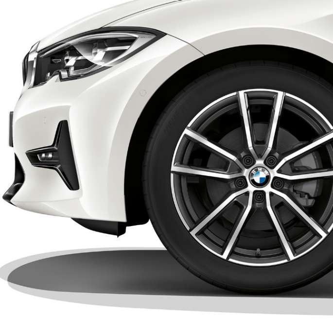 Close-up of the light alloy wheel of the BMW 3 Series Sedan with Sport Line equipment.
