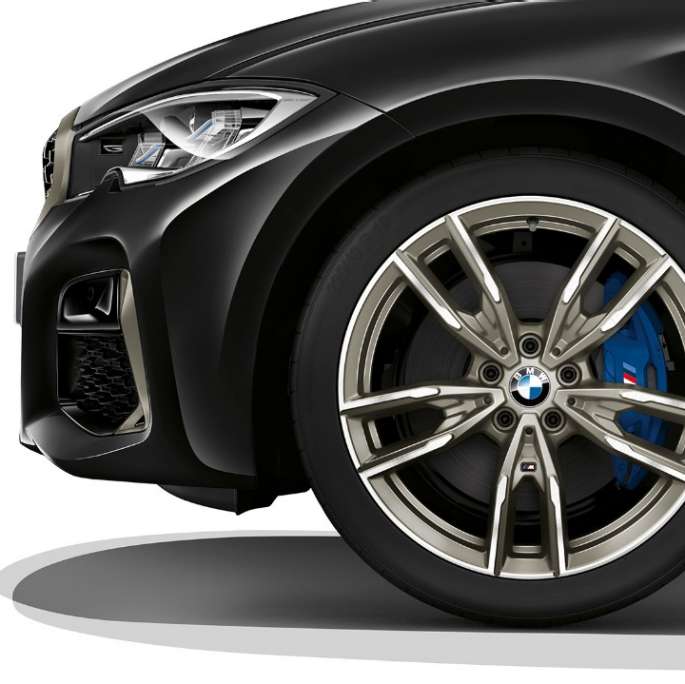 Close-up of the light alloy wheel of the BMW 3 Series M340i xDrive Sedan.