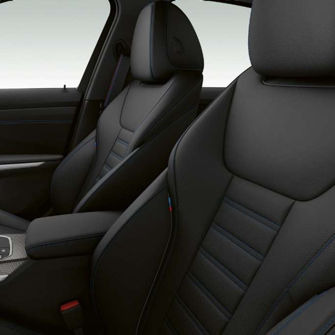 Side close-up of the front seats of the BMW 3 Series M340i xDrive Sedan.