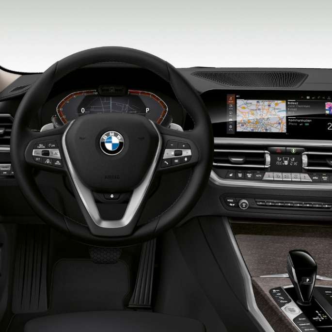 Frontal close-up of the driver's cockpit of the BMW 3 Series Sedan with Model Luxury Line features.