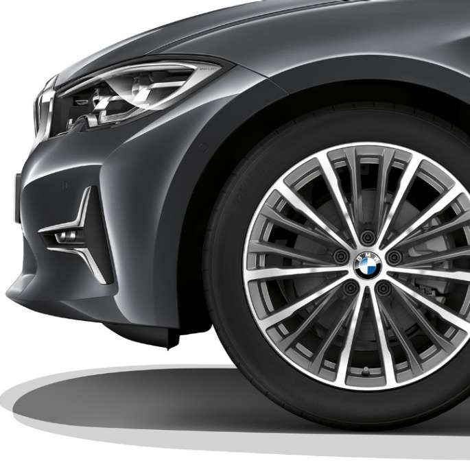 Close-up of the light alloy wheel of the BMW 3 Series Sedan with Model Luxury Line equipment.