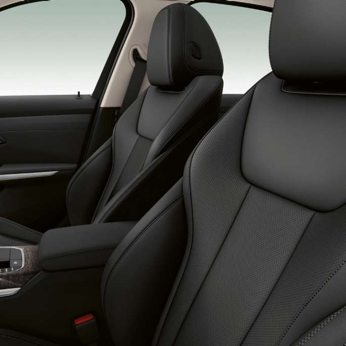 Side close-up of the front seats of the BMW 3 Series Sedan with Model Luxury Line features.
