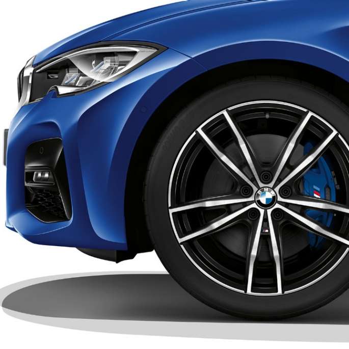 Close-up of the light alloy wheel of the BMW 3 Series Sedan with M Sport package equipment.