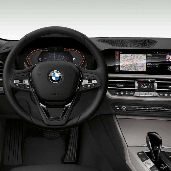 Frontal close-up of the driver's cockpit of the BMW 3 Series Sedan with model Advantage features.